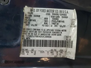 2002 Ford Explorer Sport XLS z VIN 1FMZU70E42UC30826, wystawiony jako Copart lot #42163415 z przebiegiem 148 764 mil mil oraz Szkoda całkowita • Salvage title. Historia ofert i sprzedaży dostępna na DreamBid. Obrazek 13.