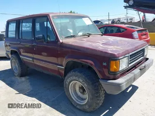 1991 Isuzu Trooper z VIN JACCH58R8M7904079, wystawiony jako IAAI lot #42303036 z przebiegiem 244 672 mil mil oraz . Historia ofert i sprzedaży dostępna na DreamBid. Obrazek 1.
