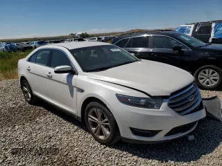 2015 Ford Taurus SEL z VIN 1FAHP2E8XFG181929, wystawiony jako Copart lot #64022325 z przebiegiem 106 272 mil mil oraz Szkoda całkowita • Salvage title. Historia ofert i sprzedaży dostępna na DreamBid. Obrazek 4.