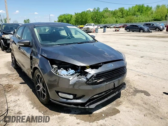 2018 Ford Focus SE z VIN 1FADP3F20JL257320, wystawiony jako Copart lot #55956435 z przebiegiem 26 919 mil mil oraz Szkoda całkowita • Salvage title. Historia ofert i sprzedaży dostępna na DreamBid. Obrazek 13.