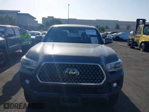 2019 Toyota Tacoma SR with VIN 3TMCZ5AN7KM251625, listed as a IAAI auction lot 42527478 with 45,689 mi miles and . Bid and sale history available at DreamBid. Image 12.