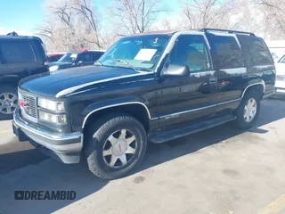 1997 GMC Yukon with VIN 1GKEK13R3VJ759103, listed as a IAAI auction lot 41726127 with 218,500 mi miles. Bid and sale history available at carsss.com. Image 2.
