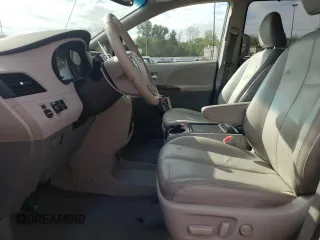 2012 Toyota Sienna XLE AAS with VIN 5TDYK3DC0CS250830, listed as a Copart auction lot 73323284 with 147,580 mi miles and Salvage Title. Bid and sale history available at DreamBid. Image 7.