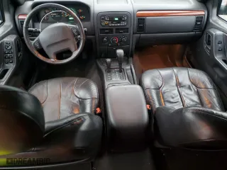 1999 Jeep Grand Cherokee Laredo with VIN 1J4GW58N0XC684111, listed as a Copart auction lot 85944784 with 128,741 mi miles and Salvage Title. Bid and sale history available at carsss.com. Image 8.