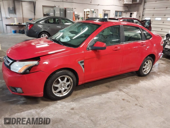 2008 Ford Focus SE with VIN 1FAHP35N48W169344, listed as a IAAI auction lot 41727580 with 203,596 mi miles. Bid and sale history available at carsss.com. Image 2.