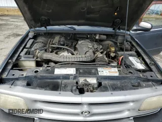 1994 Mazda B-Series Truck LE z VIN 4F4CR16X7RTM18152, wystawiony jako Copart lot #56992165 z przebiegiem 238 802 mil mil oraz Szkody całkowita. Historia ofert i sprzedaży dostępna na DreamBid. Obrazek 11.
