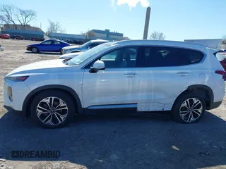 2019 Hyundai Santa Fe Ultimate with VIN 5NMS5CAA0KH067753, listed as a IAAI auction lot 41884396 with 31,343 mi miles and . Bid and sale history available at DreamBid. Image 14.