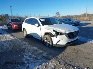 2016 Mazda CX-9 Sport z VIN JM3TCBBY1G0112956, wystawiony jako IAAI lot #41282503 z przebiegiem 69 062 mil mil oraz . Historia ofert i sprzedaży dostępna na DreamBid. Obrazek 1.