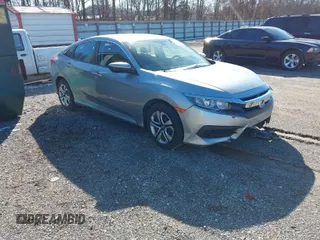 2017 Honda Civic Sedan LX with VIN 19XFC2F56HE069424, listed as a IAAI auction lot 40806146 with 71,084 mi miles. Bid and sale history available at carsss.com. Image 1.