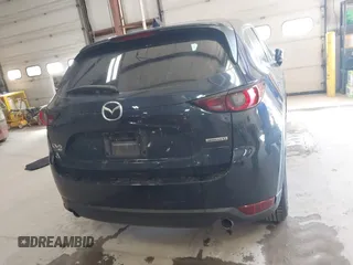 2020 Mazda CX-5 Touring with VIN JM3KFBCM6L0739077, listed as a IAAI auction lot 41810946 with 82,911 mi miles and . Bid and sale history available at carsss.com. Image 16.