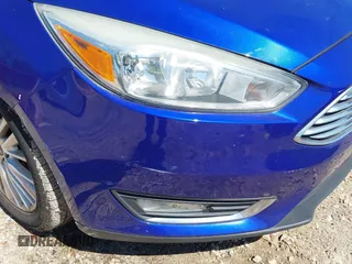 2015 Ford Focus Titanium with VIN 1FADP3J20FL304828, listed as a IAAI auction lot 42144101 with 199,715 mi miles and . Bid and sale history available at carsss.com. Image 6.