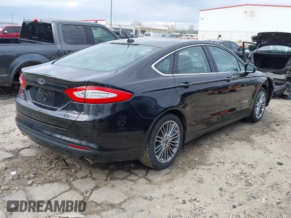 2014 Ford Fusion SE Hybrid with VIN 3FA6P0LU2ER133294, listed as a IAAI auction lot 41696064 with 150,537 mi miles. Bid and sale history available at carsss.com. Image 4.