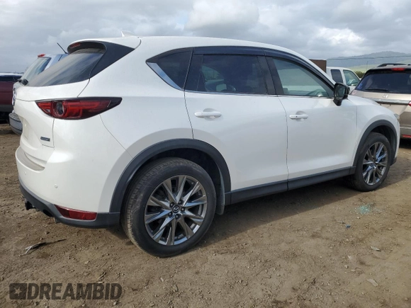 2019 Mazda CX-5 Signature with VIN JM3KFBEYXK0537826, listed as a Copart auction lot 50063015 with 76,448 mi miles and Salvage Title. Bid and sale history available at carsss.com. Image 3.