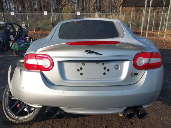 2014 Jaguar XK with VIN SAJWA4DC7EMB52199, listed as a IAAI auction lot 41191119 with 90,585 mi miles. Bid and sale history available at carsss.com. Image 16.