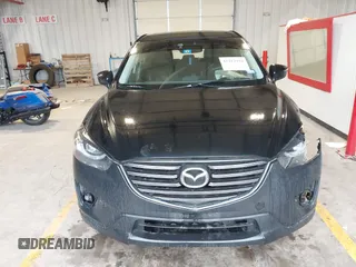 2016 Mazda CX-5 Grand Touring with VIN JM3KE2DY9G0705127, listed as a IAAI auction lot 41412910 with 181,993 mi miles. Bid and sale history available at carsss.com. Image 12.