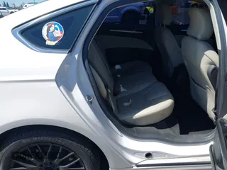 2016 Ford Fusion Titanium z VIN 3FA6P0SU2GR357508, wystawiony jako IAAI lot #42551834 z przebiegiem 177 425 mil mil oraz . Historia ofert i sprzedaży dostępna na DreamBid. Obrazek 8.