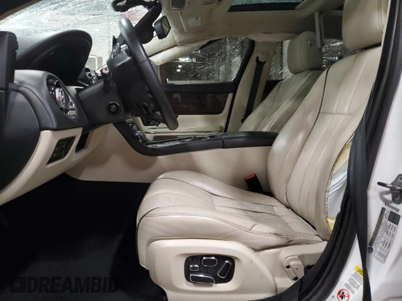 2014 Jaguar XJ Portfolio with VIN SAJWJ2GD2E8V69597, listed as a Copart auction lot 57798145 with 100,857 mi miles and Salvage title. Bid and sale history available at DreamBid. Image 7.