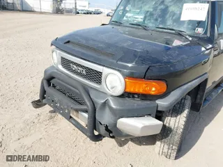 2007 Toyota FJ Cruiser with VIN JTEBU11F370035644, listed as a IAAI auction lot 41698247 with 214,482 mi miles. Bid and sale history available at carsss.com. Image 6.