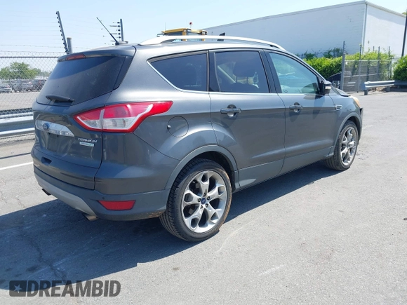2015 Ford Escape Titanium with VIN 1FMCU0J94FUB24350, listed as a IAAI auction lot 42065641 with 168,215 mi miles. Bid and sale history available at carsss.com. Image 4.