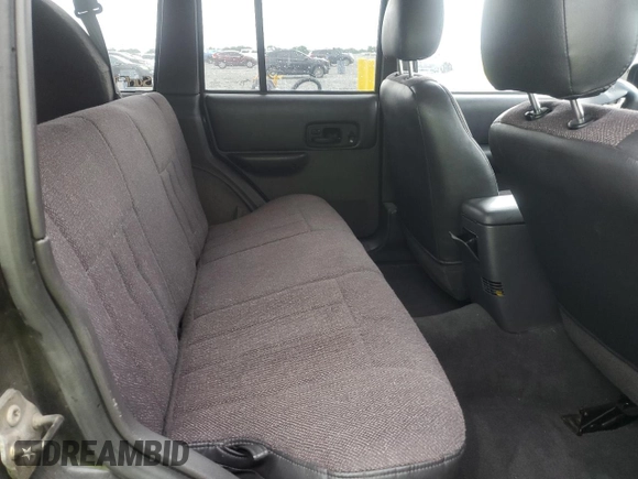 1999 Jeep Cherokee Sport with VIN 1J4FF68S7XL560943, listed as a Copart auction lot 58425505 with 68,654 mi miles and Salvage title. Bid and sale history available at DreamBid. Image 11.
