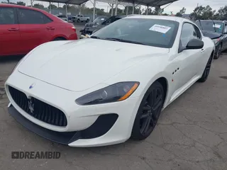 2012 Maserati GranTurismo MC Stradale with VIN ZAM45MLA9C0065671, listed as a IAAI auction lot 40990883 with 27,041 mi miles. Bid and sale history available at carsss.com. Image 2.