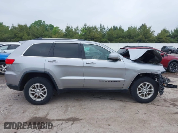 2018 Jeep Grand Cherokee Laredo z VIN 1C4RJFAG0JC129021, wystawiony jako IAAI lot #42413165 z przebiegiem 103 743 mil mil oraz . Historia ofert i sprzedaży dostępna na DreamBid. Obrazek 12.
