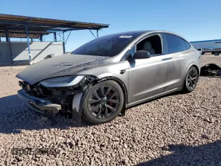 2023 Tesla Model X Plaid with VIN 7SAXCBE67PF400344, listed as a Copart auction lot 77483354 with 25,833 mi miles and Salvage Title. Bid and sale history available at DreamBid. Image 1.