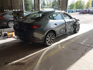 2023 Mazda 3 S Premium with VIN 3MZBPBDM5PM374492, listed as a IAAI auction lot 42025207 with 12,344 mi miles and . Bid and sale history available at DreamBid. Image 4.