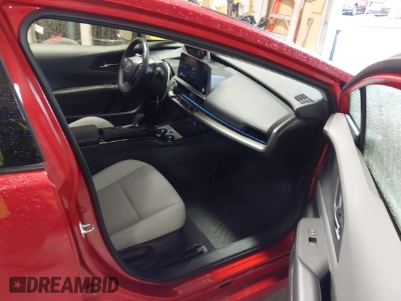 2024 Toyota Prius LE with VIN JTDACAAUXR3039886, listed as a IAAI auction lot 41928633 with 1,468 mi miles and . Bid and sale history available at DreamBid. Image 5.