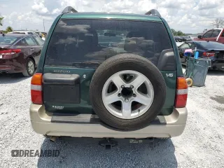 2002 Suzuki Grand Vitara JS z VIN JS3TE62V924151538, wystawiony jako Copart lot #58900085 z przebiegiem 130 514 mil mil oraz Szkoda całkowita • Salvage title. Historia ofert i sprzedaży dostępna na DreamBid. Obrazek 6.
