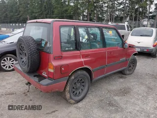 1995 Suzuki Sidekick z VIN JS3TD03V3S4106626, wystawiony jako IAAI lot #41877506 z przebiegiem 166 928 mil mil oraz . Historia ofert i sprzedaży dostępna na DreamBid. Obrazek 4.
