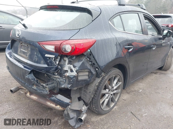 2018 Mazda 3 Touring with VIN 3MZBN1L34JM204883, listed as a IAAI auction lot 41094541 with 125,205 mi miles and . Bid and sale history available at DreamBid. Image 6.