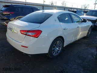 2014 Maserati Ghibli S Q4 with VIN ZAM57RTA1E1096387, listed as a IAAI auction lot 41424049 with 100,970 mi miles. Bid and sale history available at carsss.com. Image 4.