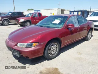 2000 Pontiac Grand Prix SE with VIN 1G2WJ52K3YF262773, listed as a IAAI auction lot 42031719 with 164,284 mi miles. Bid and sale history available at carsss.com. Image 2.