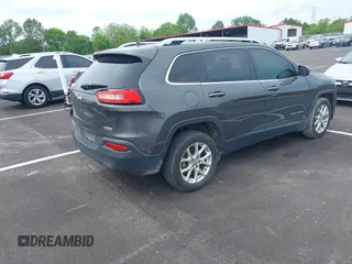 2015 Jeep Cherokee Latitude with VIN 1C4PJLCB5FW689811, listed as a IAAI auction lot 42113567 with 113,740 mi miles and . Bid and sale history available at carsss.com. Image 4.