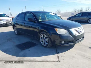 2009 Toyota Avalon XL with VIN 4T1BK36B89U335604, listed as a IAAI auction lot 41328877 with 166,396 mi miles. Bid and sale history available at carsss.com. Image 1.