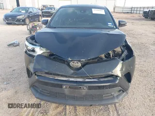 2018 Toyota C-HR XLE with VIN JTNKHMBX6J1007058, listed as a IAAI auction lot 42100587 with 71,725 mi miles and . Bid and sale history available at DreamBid. Image 6.