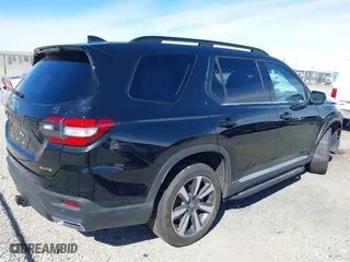 2023 Honda Pilot Elite with VIN 5FNYG1H80PB007959, listed as a IAAI auction lot 41677282 with 28,892 mi miles. Bid and sale history available at carsss.com. Image 4.
