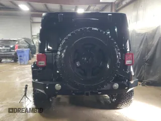 2015 Jeep Wrangler Unlimited Rubicon Hard Rock with VIN 1C4HJWFG4FL676868, listed as a Copart auction lot 48489525 with 100,771 mi miles and Salvage title. Bid and sale history available at DreamBid. Image 6.