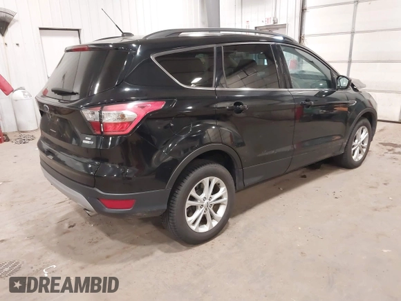 2017 Ford Escape SE with VIN 1FMCU9G98HUD67920, listed as a IAAI auction lot 40937291 with 124,302 mi miles. Bid and sale history available at carsss.com. Image 4.