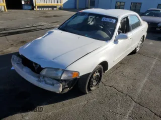 1999 Mazda 626 LX with VIN 1YVGF22D4X5882600, listed as a Copart auction lot 69031604 with 0 mi miles and Salvage Title. Bid and sale history available at carsss.com. Image 1.