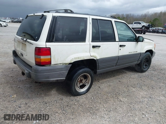 1996 Jeep Grand Cherokee Laredo with VIN 1J4FX58S1TC278511, listed as a IAAI auction lot 41837339 with 303,947 mi miles. Bid and sale history available at carsss.com. Image 4.
