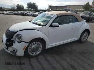 2015 Volkswagen Beetle 1.8T with VIN 3VW517AT6FM802771, listed as a Copart auction lot 72225834 with 128,946 mi miles and Salvage title. Bid and sale history available at DreamBid. Image 1.