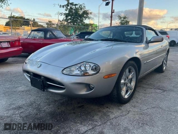1999 Jaguar XK z VIN SAJGX204XXC041660, wystawiony jako Copart lot #88755785 z przebiegiem 70 091 mil mil oraz Tytuł czysty. Historia ofert i sprzedaży dostępna na DreamBid. Obrazek 2.