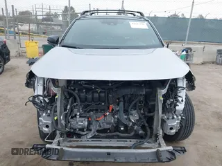 2021 Toyota RAV4 Hybrid XSE z VIN 4T3E6RFV9MU027713, wystawiony jako IAAI lot #42587759 z przebiegiem 28 806 mil mil oraz . Historia ofert i sprzedaży dostępna na DreamBid. Obrazek 13.