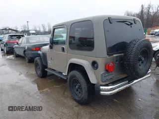 2006 Jeep Wrangler Sport Right Hand Drive with VIN 1J4F449S06P725862, listed as a IAAI auction lot 41562989 with 121,997 mi miles. Bid and sale history available at carsss.com. Image 3.