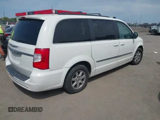 2012 Chrysler Town & Country Touring L with VIN 2C4RC1CG7CR156415, listed as a IAAI auction lot 42045371 with 233,306 mi miles and . Bid and sale history available at carsss.com. Image 4.