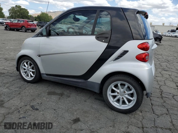 2009 Smart fortwo Pure with VIN WMEEJ31X89K251402, listed as a Copart auction lot 56791545 with 52,636 mi miles and Clean title. Bid and sale history available at DreamBid. Image 2.