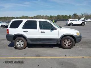 2005 Ford Escape XLT with VIN 1FMYU03165KA93495, listed as a IAAI auction lot 41821975 with 202,475 mi miles and . Bid and sale history available at DreamBid. Image 13.