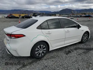2021 Toyota Corolla Hybrid LE with VIN JTDEAMDE3MJ013373, listed as a Copart auction lot 48709785 with 136,422 mi miles and Salvage Title. Bid and sale history available at carsss.com. Image 3.
